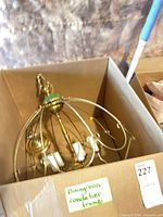 Chandelier frame in box showing overall size and shape