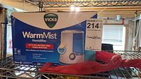 Front of retail box showing Vicks WarmMist Humidifier graphics