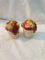 Front view of both ceramic fruit basket shakers