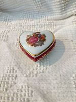 Top view showing heart shape, burgundy band, gold gilt, romantic couple scene