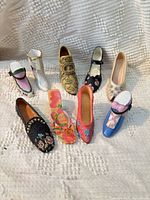 Group shot of all nine miniature shoes
