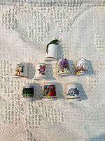 All nine thimbles arranged on cloth background