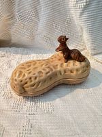 Closed dish showing peanut shape and squirrel finial