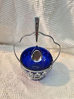 Full view of assembled salt cellar with spoon and handle