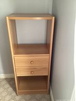 Tall open tower with two drawers and shelves
