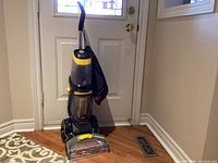 Full view of Bissell ProHeat 2X Revolution carpet cleaner with accessory bag attached