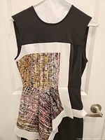 Front view of sleeveless dress on hanger