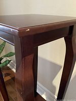 Corner and leg detail showing veneer and small chip