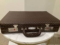 Closed Carl Weill hard case with handle and combination locks