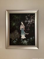 Full view of standing maiden painting in silver frame