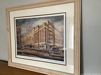 Front view of framed print showing artwork, frame, mat, and glass