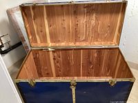 Chest open showing full cedar-lined interior