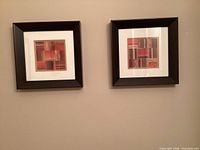 Both framed prints hung side by side showing size and matching design
