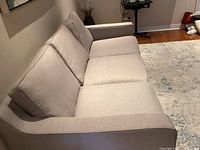 Side view of light gray 3-seat sofa
