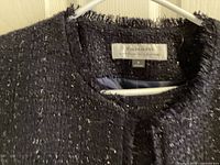 Close-up of Tahari label and tweed texture