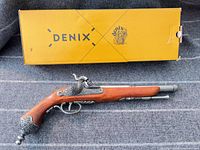 Left side view of Denix flintlock pistol with original box