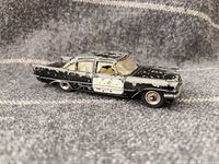 Left side view of diecast DeSoto Fireflite sedan showing paint wear and wheels