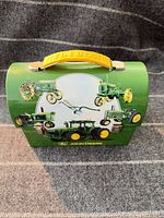 Front view showing tractor graphics, clasp and handle