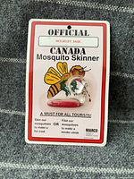 Front view of carded Marco mini pocket cutter keychain