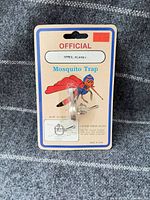 Front view of blister-packed mosquito trap on card