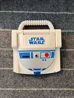 Closed R2-D2 learning laptop top view showing Star Wars logo and exterior condition