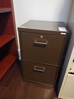 Front view of brown two-drawer filing cabinet