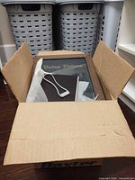 open box showing ribbed wood frame marked Vintage Editions and another frame beneath