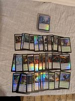 Foil Magic cards spread out showing variety and holo finish