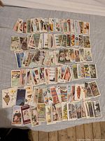 All cards spread out on cloth, showing quantity and variety