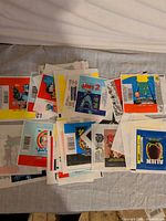 Pile of assorted card wrappers showing Jaws 2, Alien, RoboCop 2, TMNT, Tiny Toons artwork
