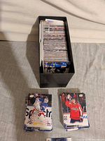 Black plastic card holder filled with 2022-23 Upper Deck Series 1 hockey cards plus two visible loose stacks