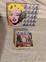 Warhol sealed puzzle box and Beatles puzzle tin group shot