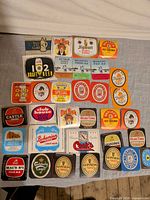 Overall lot showing all 34 beer labels laid out