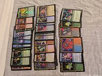 Wide view of all foil Un-Series cards laid out in three columns