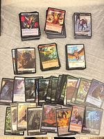 Stacks and spread of MTG token cards showing variety of artwork and types