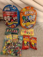 Overview showing sealed Hockey Stars blister, sealed 6-Bean blister, loose foam tray, sealed Marvel packs, bag of loose beanz