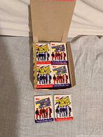 Open Topps retail box showing two rows of sealed NKOTB card packs
