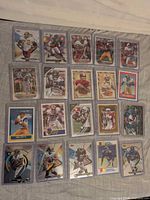 All 20 Topps NFL cards in sleeves, laid out