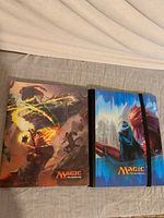 Two Ultra PRO Magic binders side by side