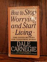 Front cover of Dale Carnegie paperback "How to Stop Worrying and Start Living" showing title, subtitle and size context