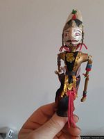 Front view of wooden puppet doll