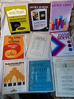 Overview of assorted piano and organ sheet music booklets and pamphlets