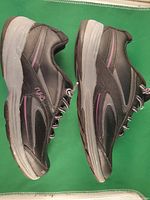 Side view of both shoes showing overall style and condition