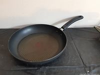 Top view of fry pan showing interior surface and handle