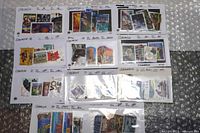 Overview of all 11 stock cards laid out showing quantity and variety of Canadian stamps