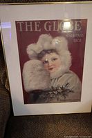 Full view of framed advertisement showing artwork and frame