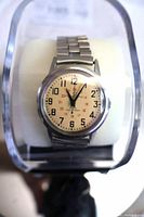 Watch on display showing full bracelet and dial