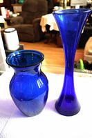 both cobalt blue glass vases side by side