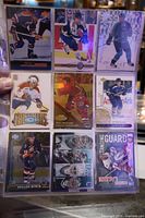 Fronts of first 9 cards in sheet, various brands and players