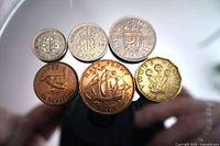 Front view of all six coins showing designs and dates